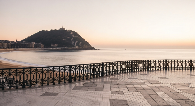 San Sebastian La Concha bay at dawn with cast-iron promenade railing